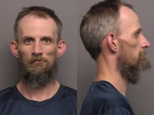 Motorcycle Driver Arrested on Warrants After Passenger Falls Off Back