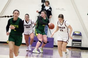 Intense Battle Ends in Upset for the Cougars 54-50 (Photo Gallery)